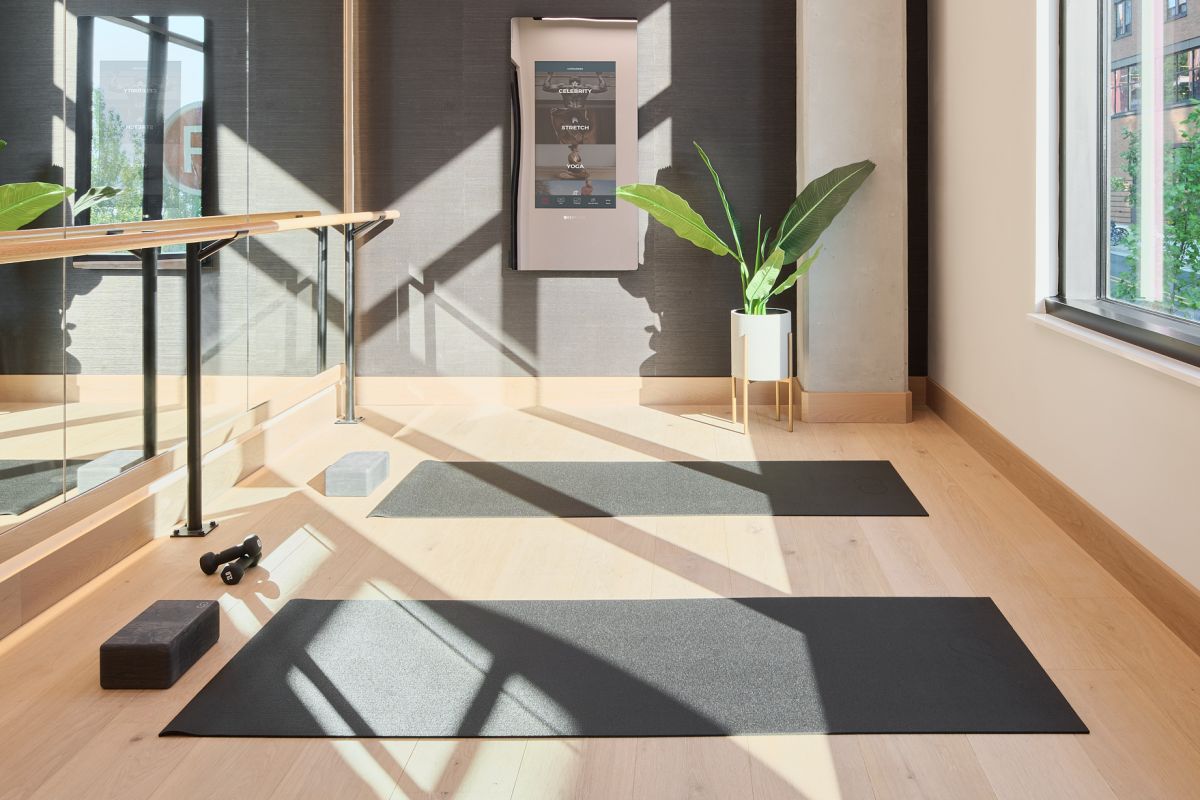 The Vue at Charlotte, NC apartment with large open-space concept kitchen, a kitchen island with stainless steel sink, granite slab countertops, and abundant custom cabinets floor to ceiling