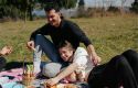 Friends having picnic in the grass
