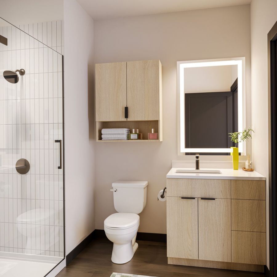 EVER West Lafayette VIP bathroom with lighted vanity, minimalist cabinet design, quartz countertops, and white tiles in the shower