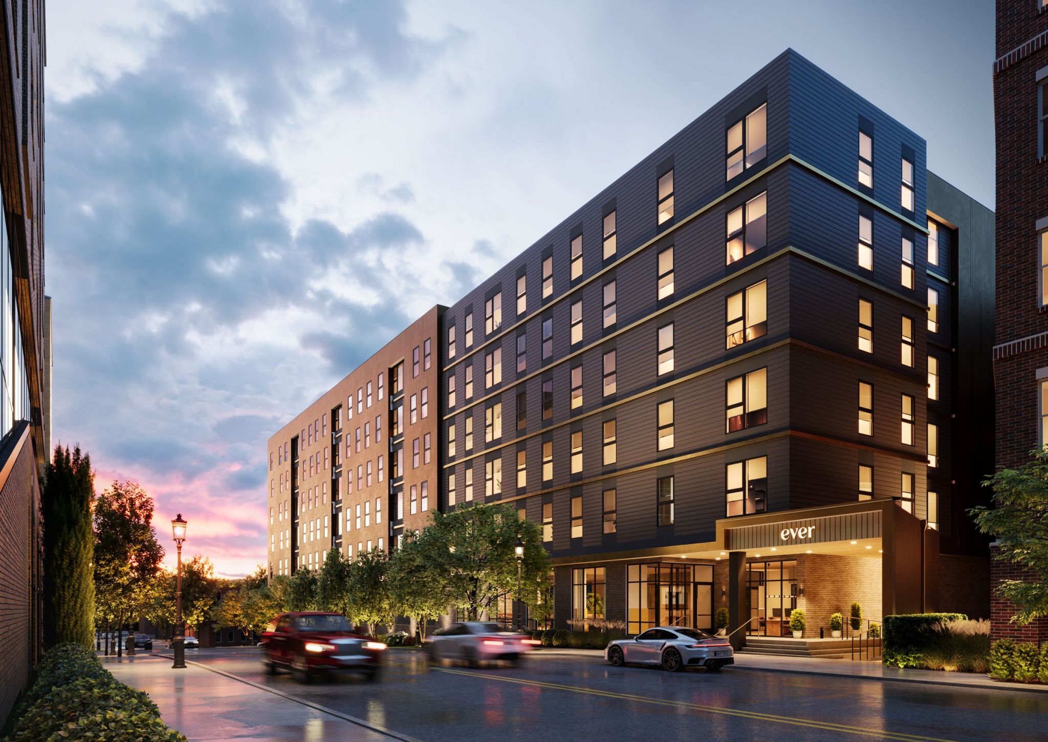 EVER West Lafayette exterior rendering street view, building lit up in the evening light